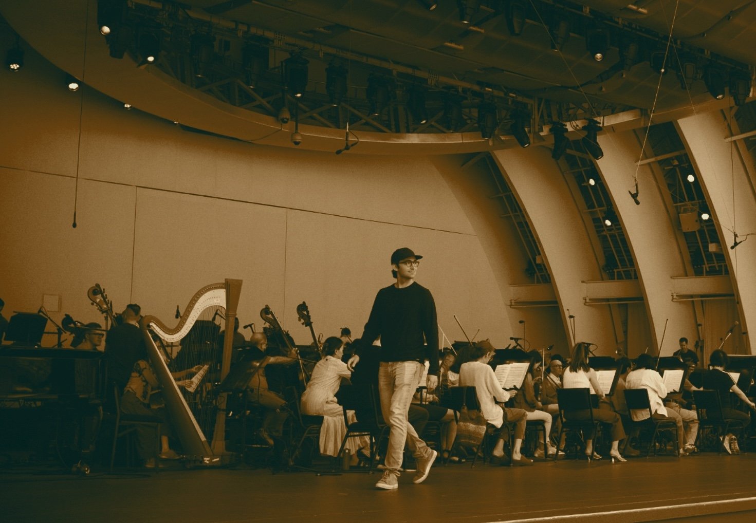 Film & TV composer Daniel Slatkin walking on stage at the Hollywood Bowl during the rehearsal of his music with the LA Philharmonic